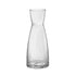 A clear Exclusiva glass carafe with a sleek design, featuring vertical ridges and a narrow neck.