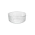 A clear round Exclusiva glass serving bowl with a multifaceted texture.