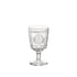 A clear glass with a Victorian-inspired design, featuring intricate embossed patterns and a wide mouth.